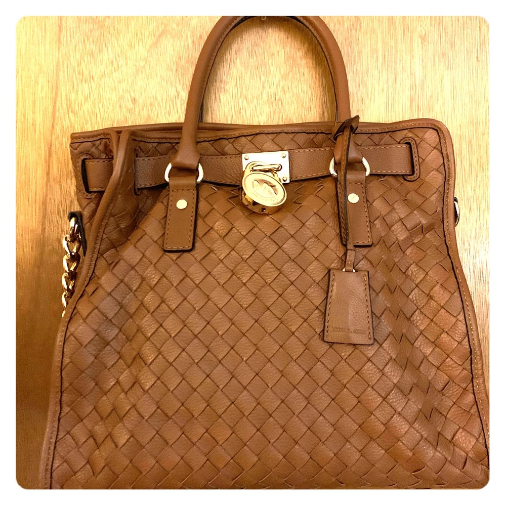 Authentic Michael Kors basket weave handbag.